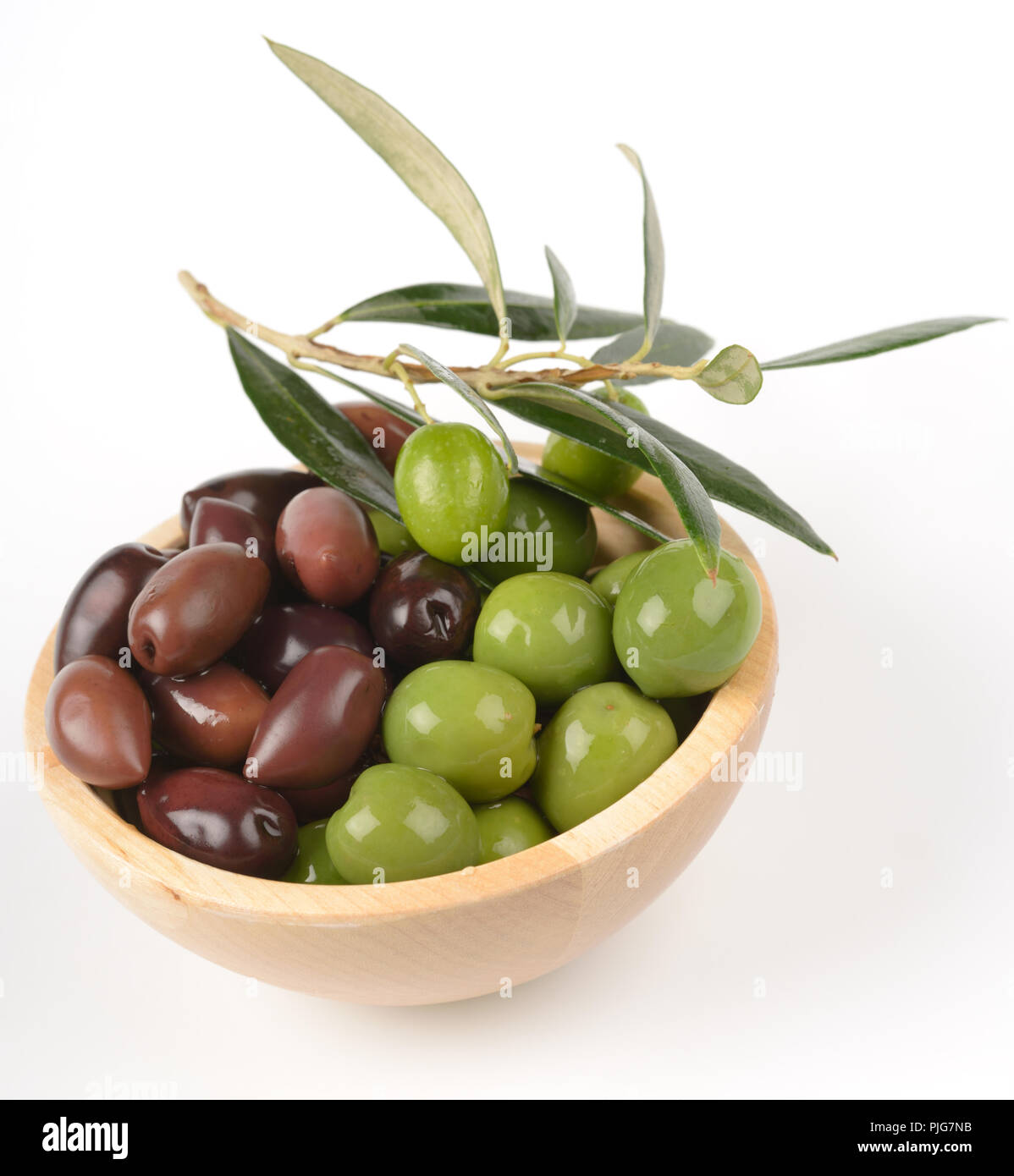 Olives in a bowl against white background Stock Photo - Alamy