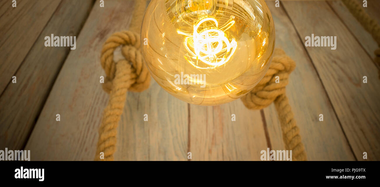 Open Bulb With Rope Rope light bulb over weathered wooden background. Low angle view Stock ...