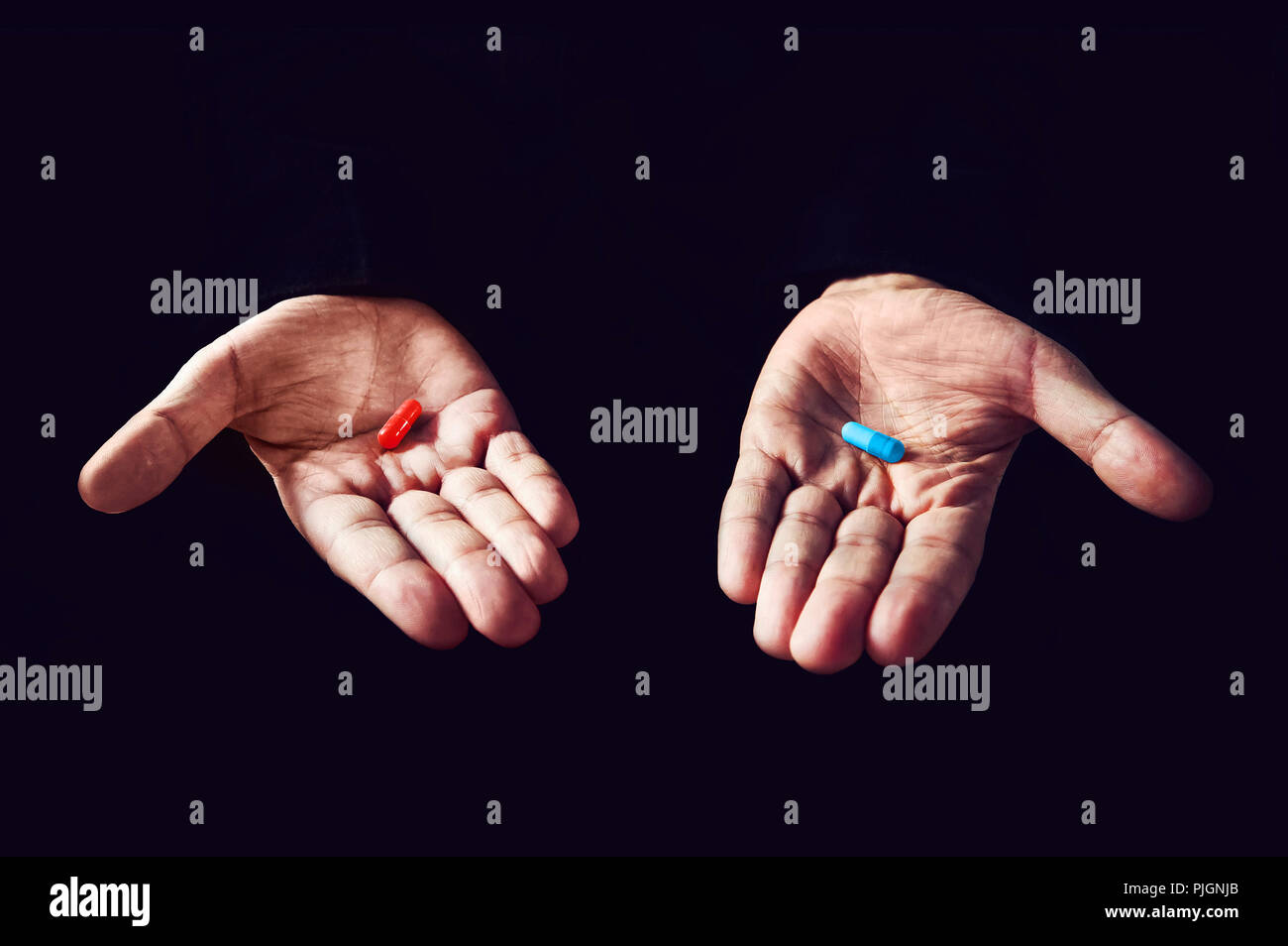 Red Pill Blue Pill concept. The right choice the concept of the movie matrix. The choice of tablets. Stock Photo