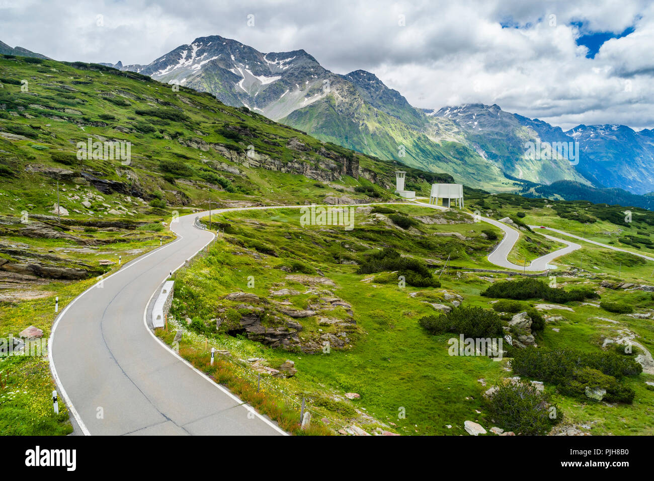 Curvy pass road San Bernadino Pass, with clouds, canton of Grisons, Switzerland Stock Photo