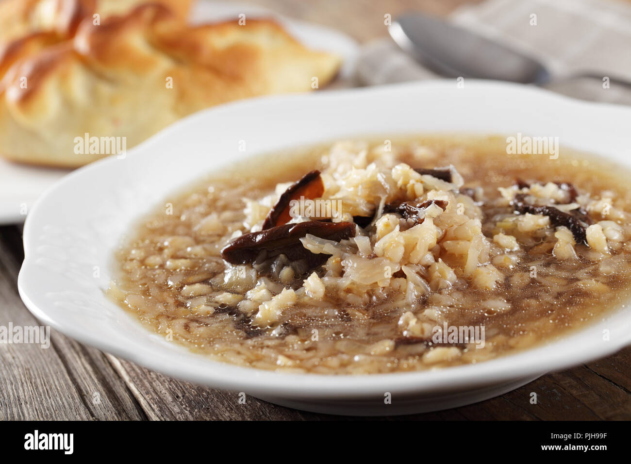 Russian sauerkraut sout with mushrooms and pearl barley Stock Photo