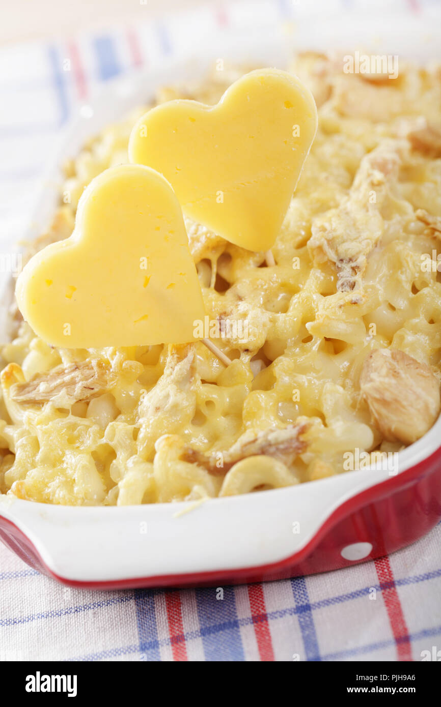 Cheese hearts in the macaroni and cheese with chicken meat Stock Photo