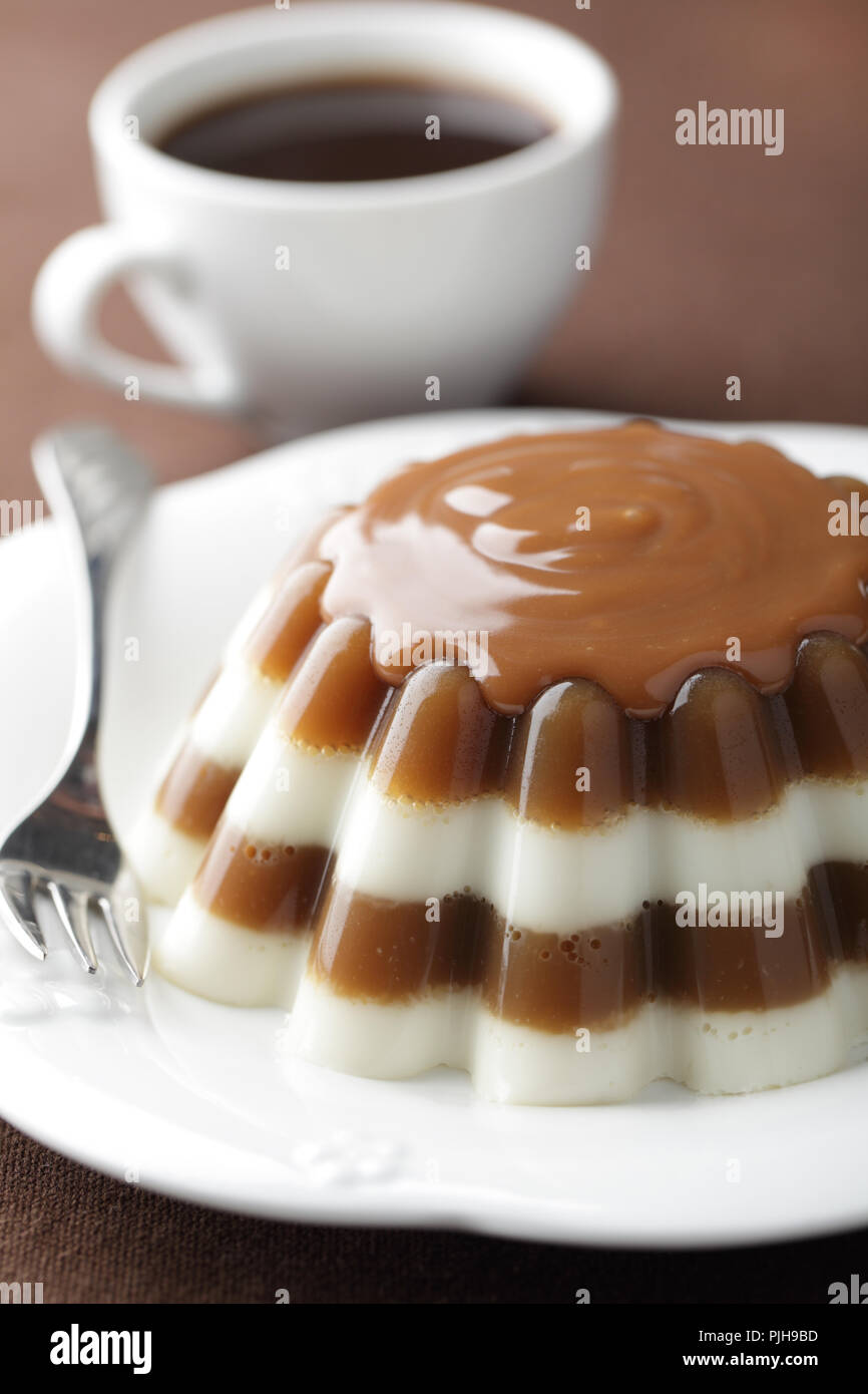 Coffee and milk gelatin dessert with caramel sauce Stock Photo Alamy
