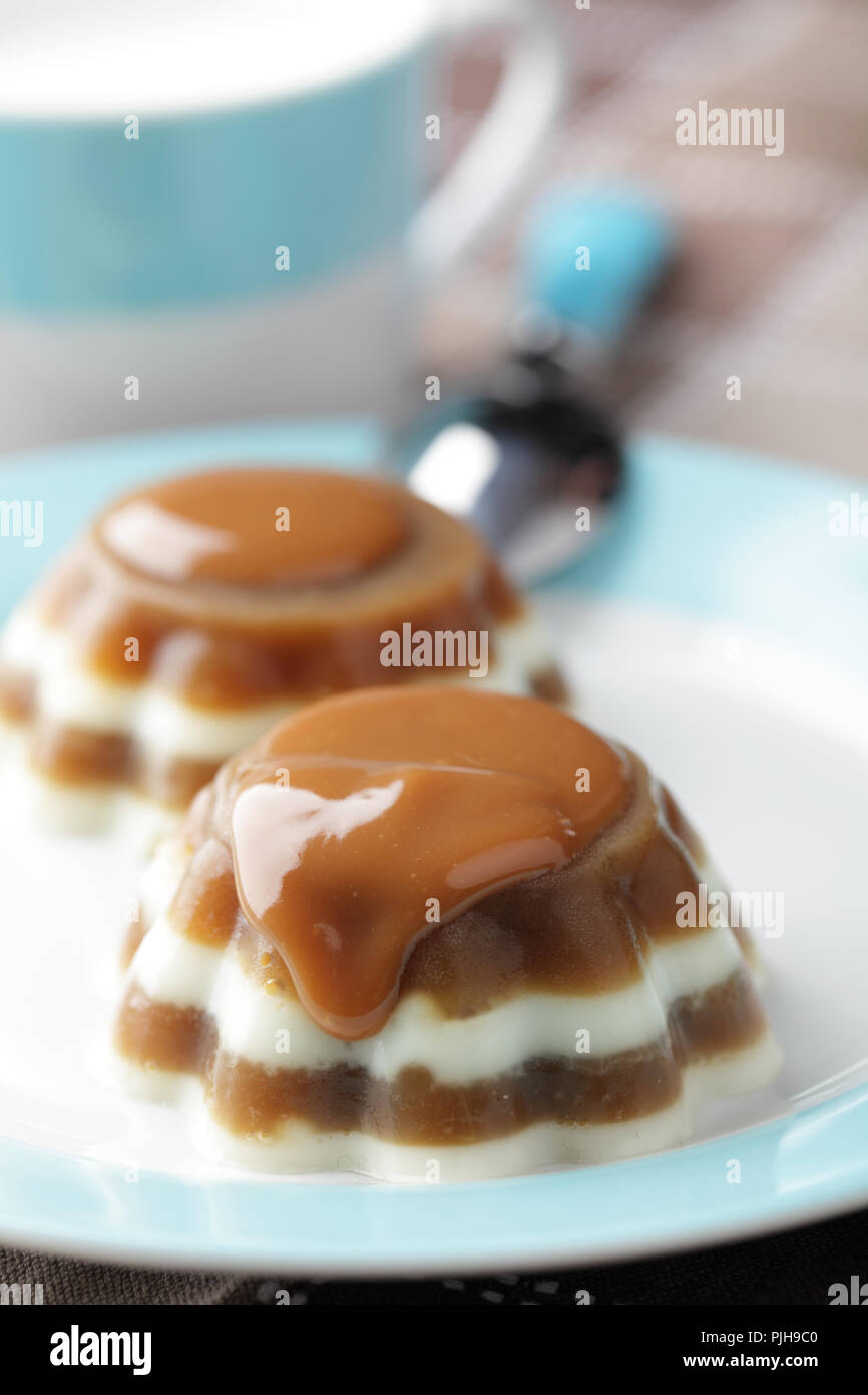 Coffee and milk gelatin dessert with caramel sauce Stock Photo Alamy