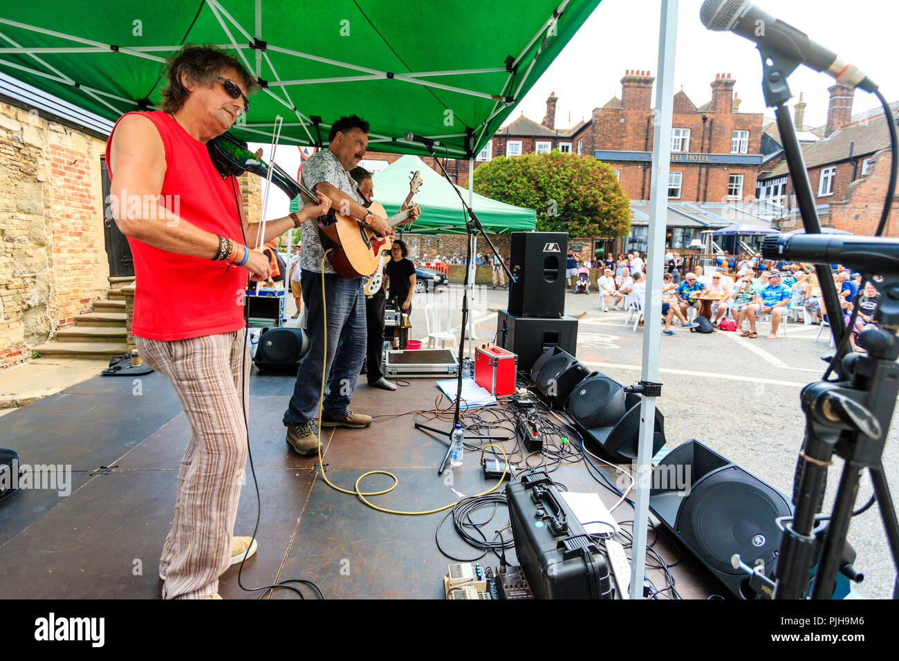 The Hot Rats performing on a small open stage during the Sandwich Folk