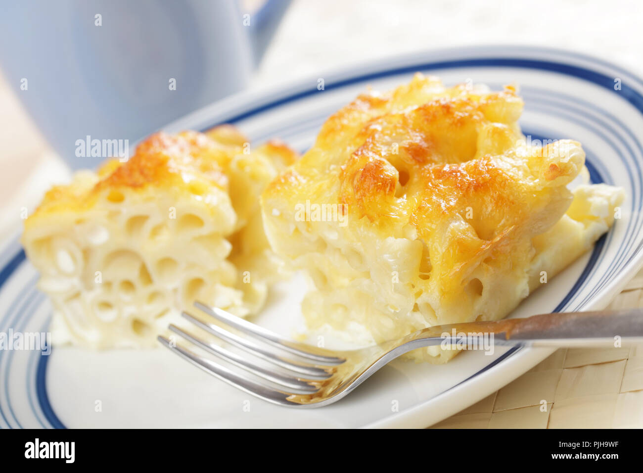 Macaroni and cheese on the plate closeup Stock Photo