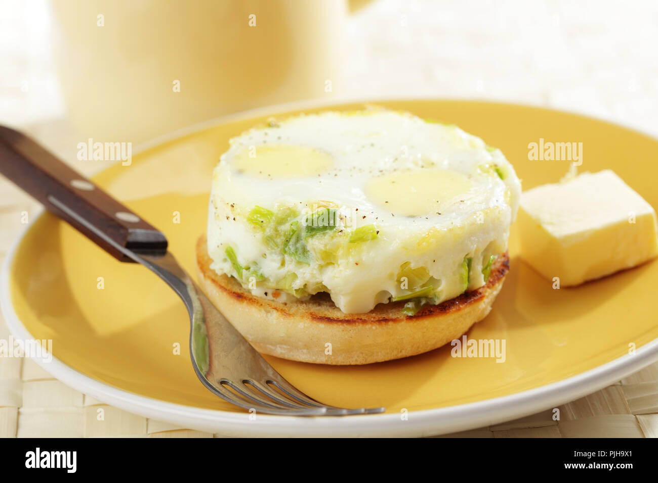 Breakfast with baked eggs on the toasted bun Stock Photo Alamy