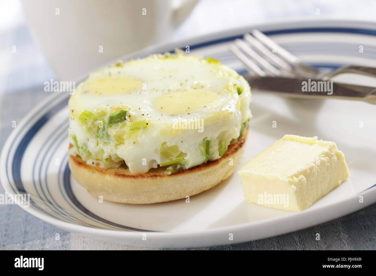 Breakfast with baked eggs on the toasted bun Stock Photo Alamy