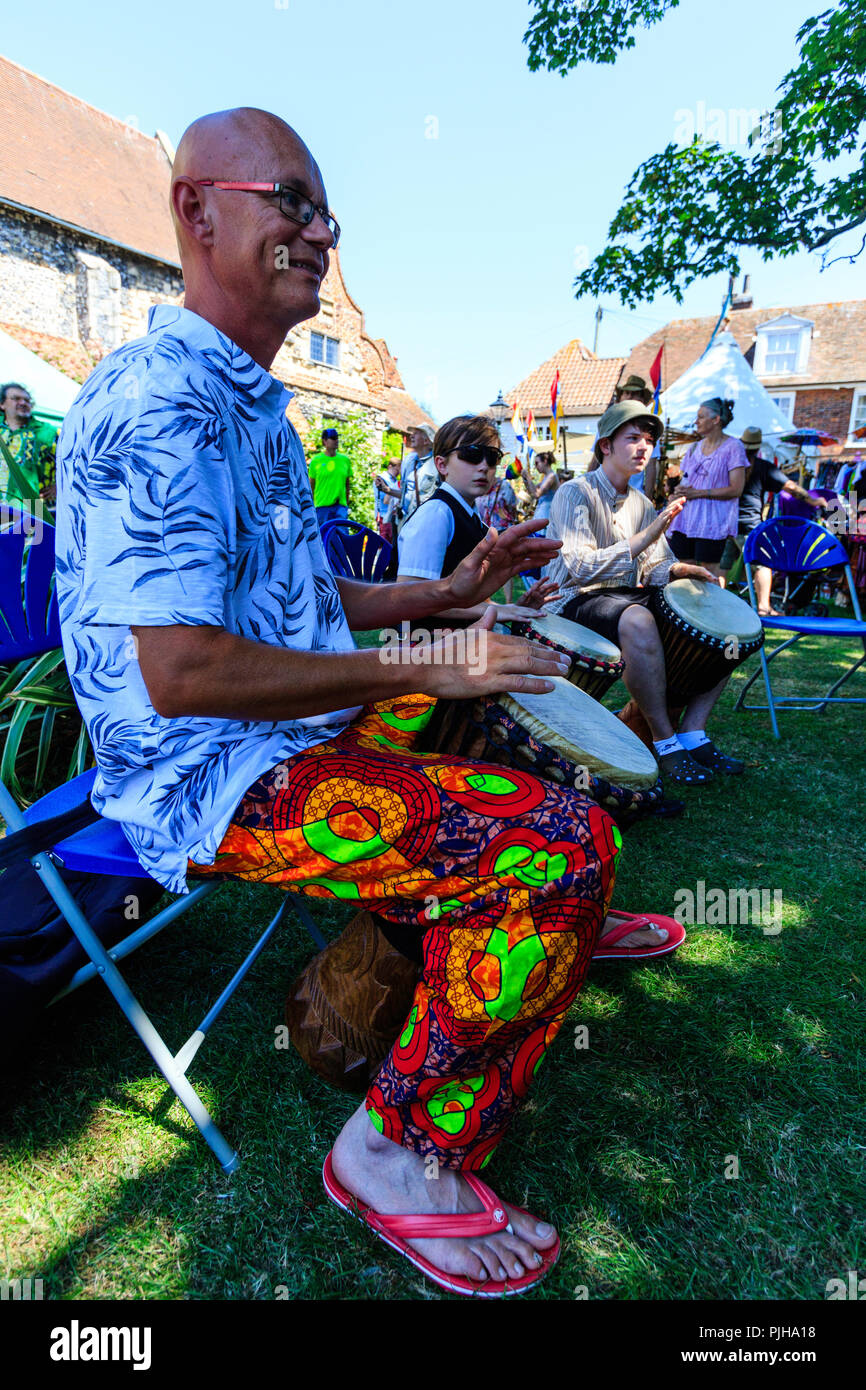 Caucasian Male, 40s, Richard Latham, Rich Rhythms, drummer leading an open air workshop during event at Sandwich town in Kent. Stock Photo