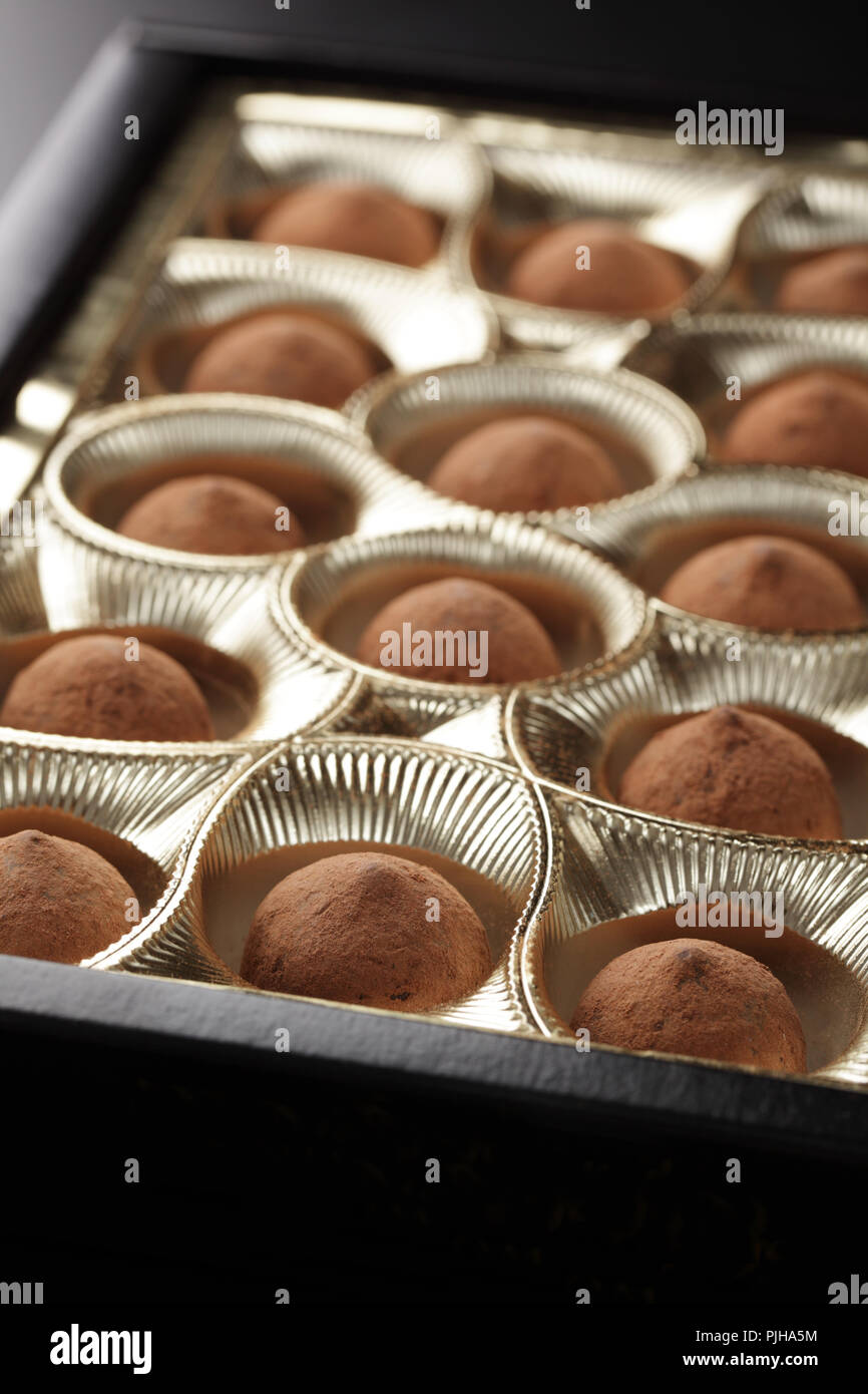 Chocolate truffles in the box closeup Stock Photo