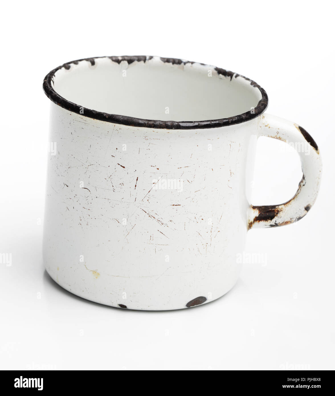 Vintage enamel mug isolated on white background Stock Photo - Alamy