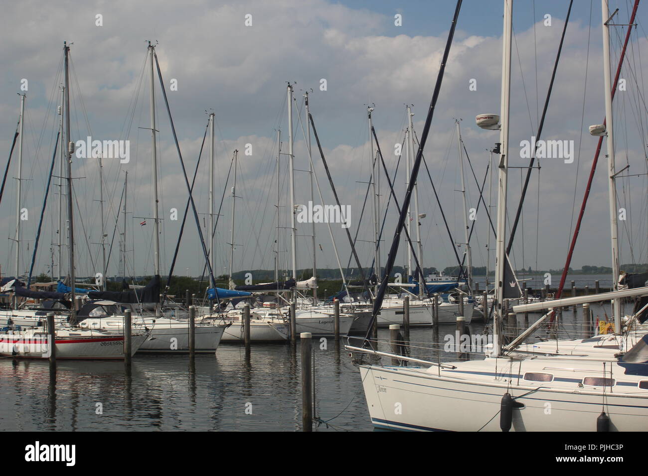 Some boats at the dock on the water Stock Photo - Alamy