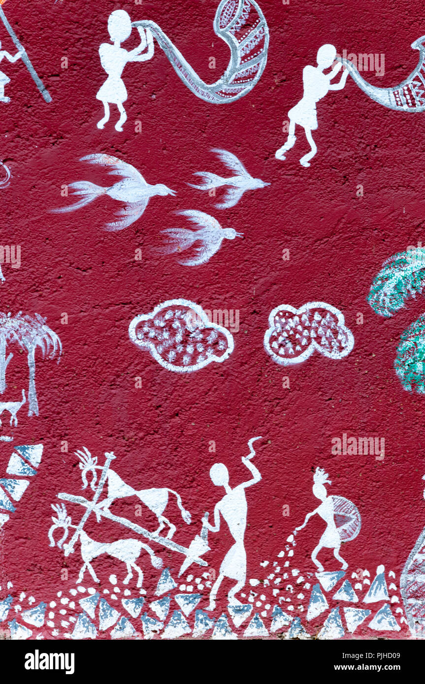 MUMBAI, INDIA – August 9 2018: Farming scenes; music being made with tradional horns and drums, depicted on a mural at a Warli temple inside the Natio Stock Photo