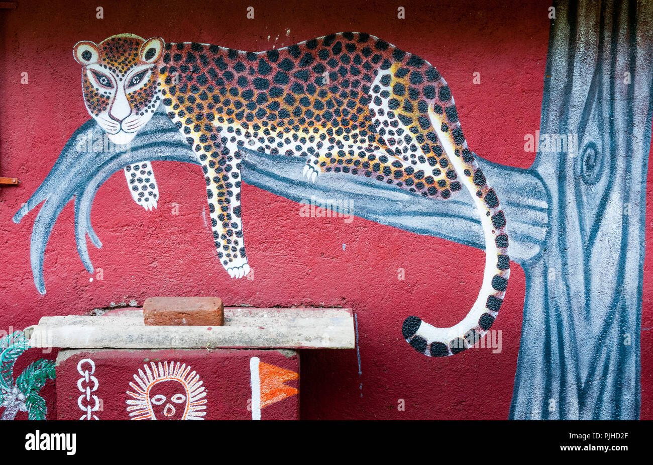 MUMBAI, INDIA – August 9 2018: Leopard painted on the wall of a Warli big-cat temple. Warli are indigenous tribal people. Stock Photo
