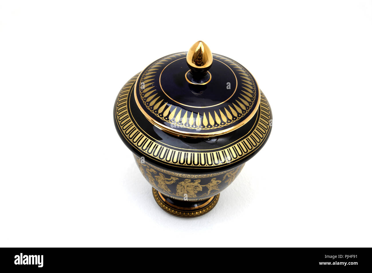 Black Greek Key Urn with 24 Carot Gold Design Stock Photo