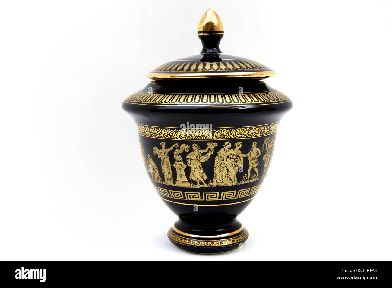 Black Greek Key Urn with 24 Carot Gold Design Stock Photo
