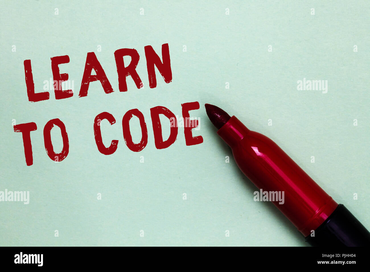 Handwriting text Learn To Code. Concept meaning Learn to write Software ...