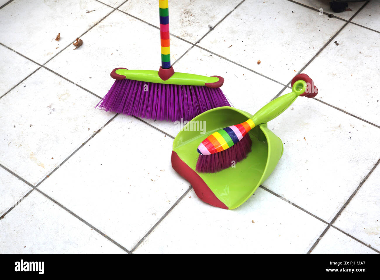 Matching Set of Colourful Dustpan and Brush with Broom Stock Photo