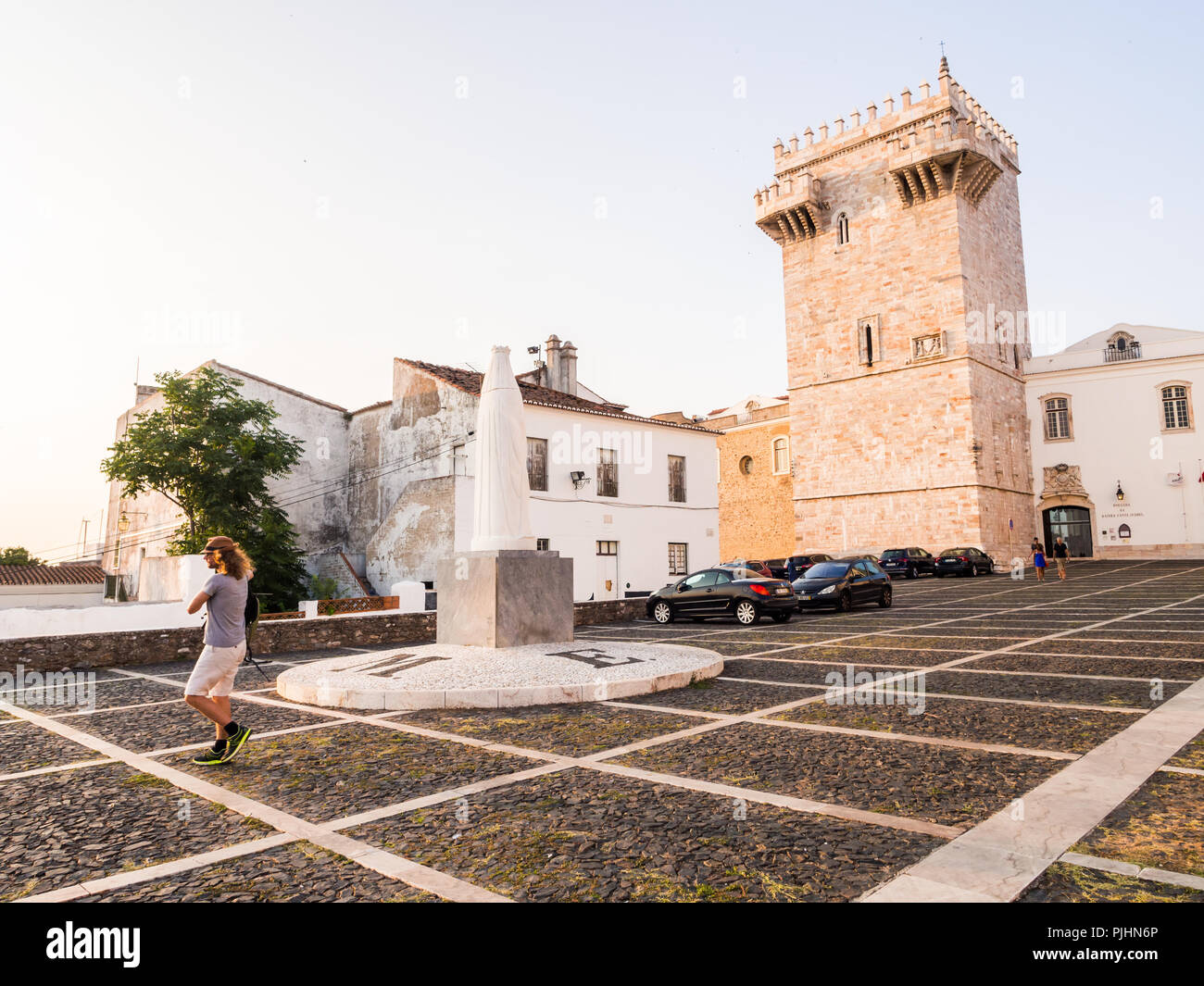 ESTREMOZ, PORTUGAL – AUGUST 23, 2018: Estremoz Castle (Castelo da Rainha Santa Isabel) with Tres Coroas (Three Crowns) marble tower and Santa Isabel m Stock Photo