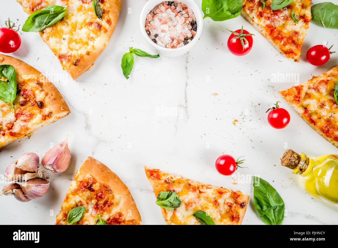 Homemade sliced cheesy classic italian pizza with ingredients and olive