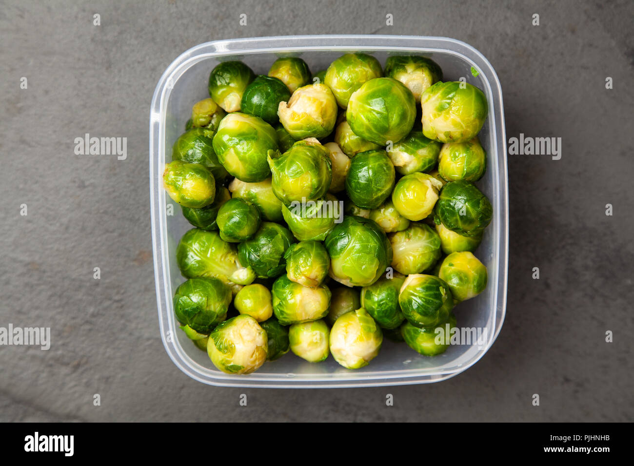 Brussles sprouts in a plastic container Stock Photo