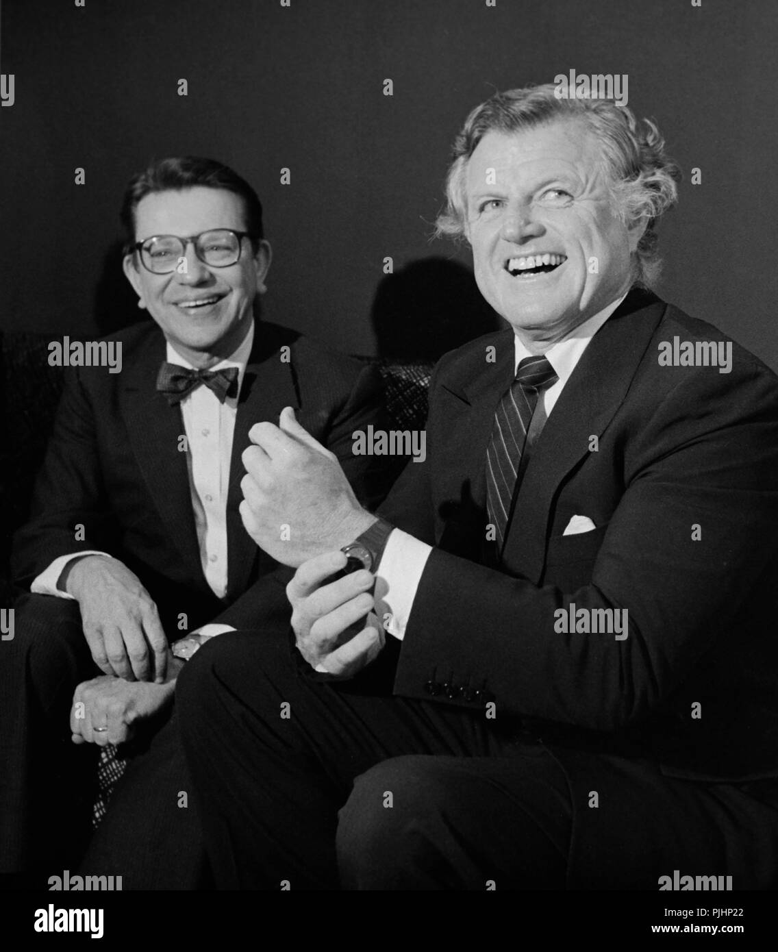 Illinois Senator Paul Simon, left, and Massachusetts Senator Ted Kennedy share a laugh together, ca. 1984. Stock Photo