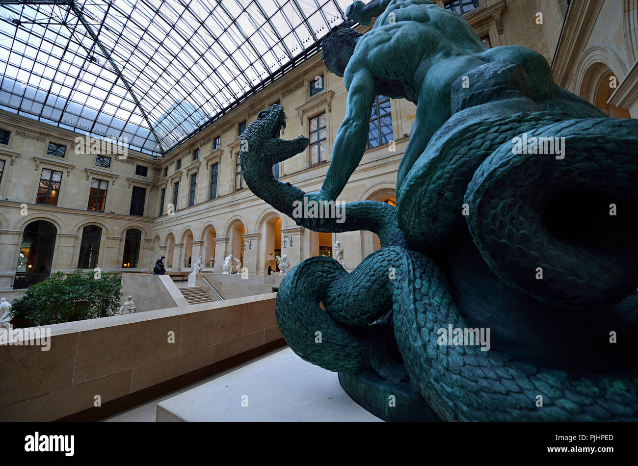 Europe, France, Paris, bronze statue of a man fighting a snake Stock ...