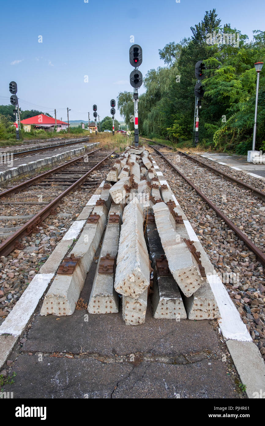Bunch of old concrete railway sleepers on the train station platform. Stock Photo