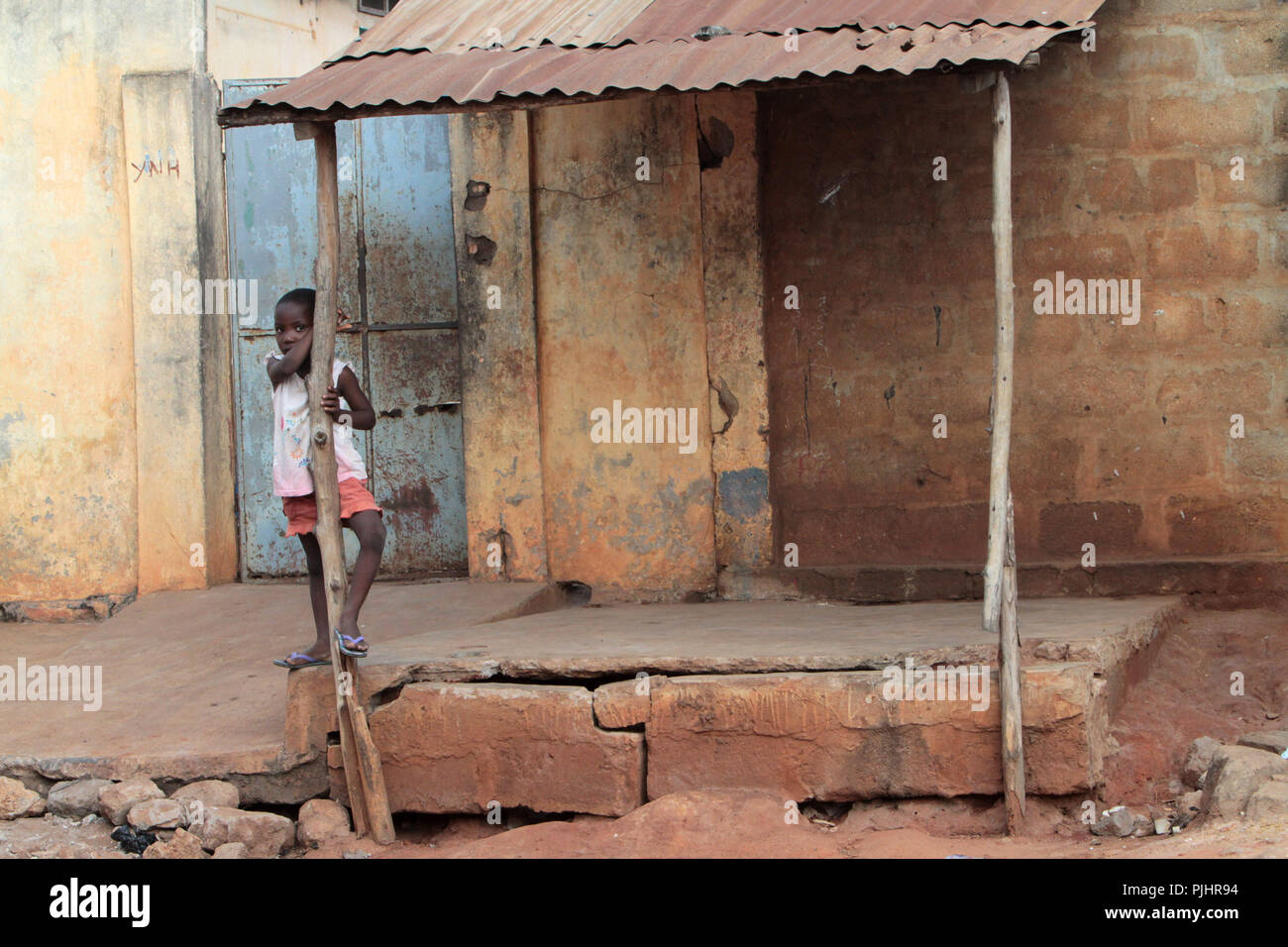 Togolese girl in front of a house. Lome. Togo Stock Photo Alamy