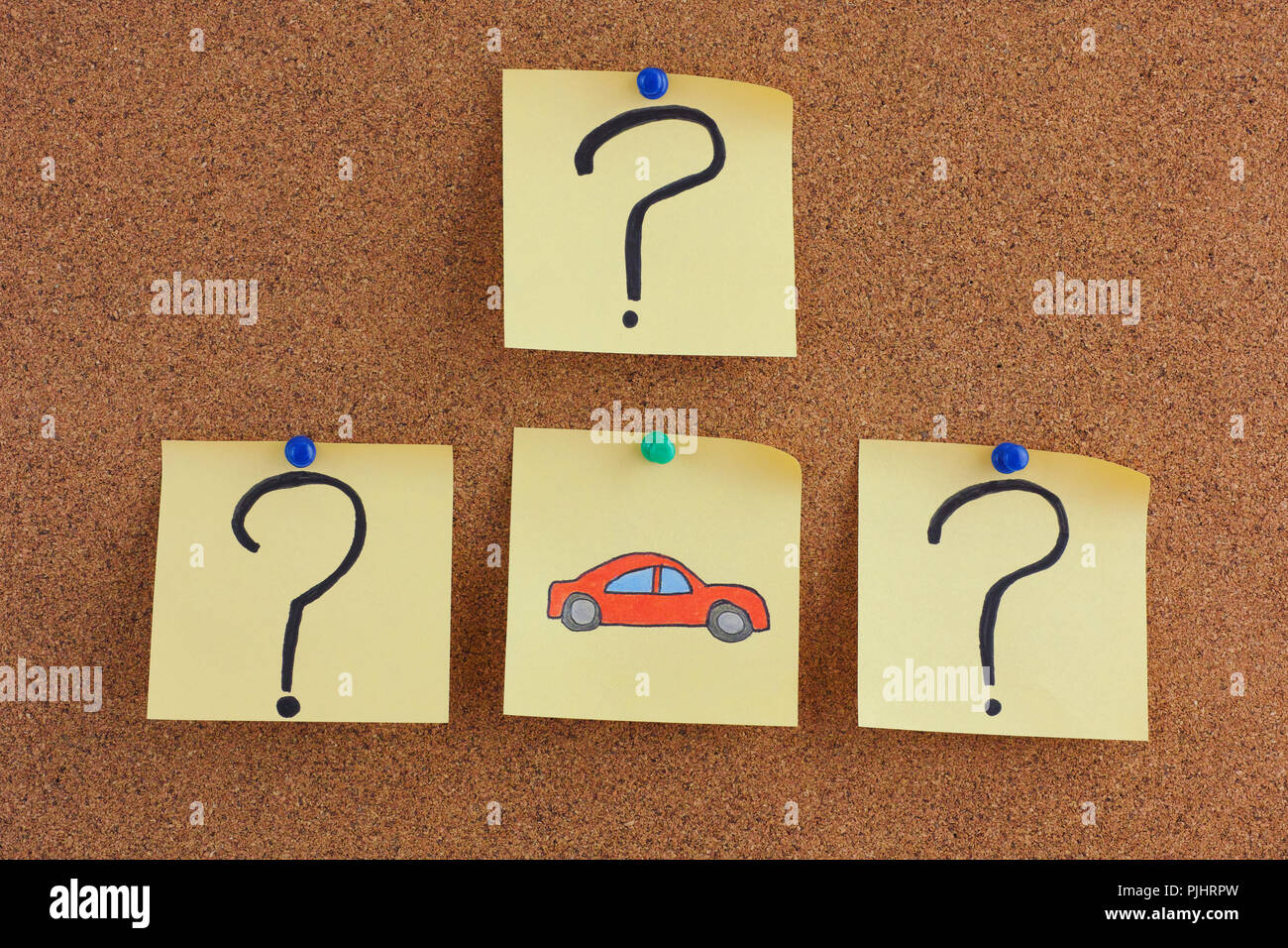 Car Questions. Post it notes with car and question marks on bulletin board. Close up. Stock Photo