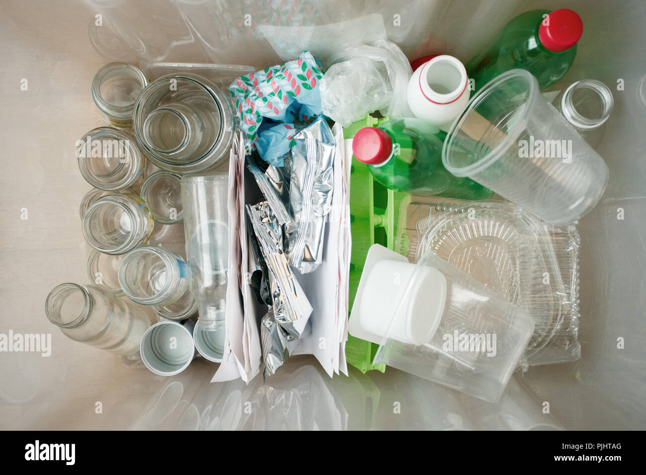 Recycling and ecology. Sorting segregating household waste paper, glass
