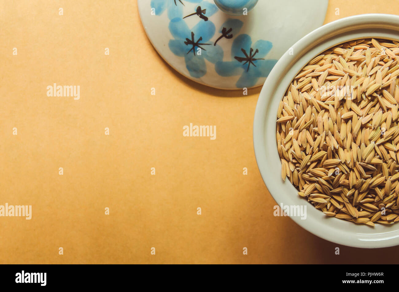 Top view of paddy rice and rice seed on the wooden floor, Background ...