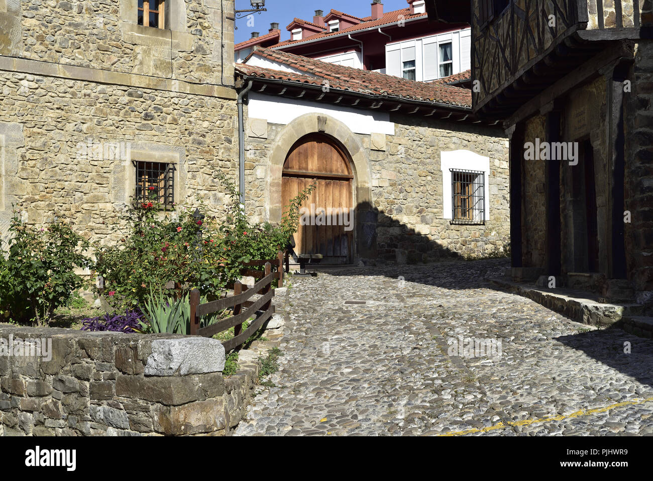 An enclosed residential street in Potes, Picos de Europa, Cantabria, northern Spain. Stock Photo
