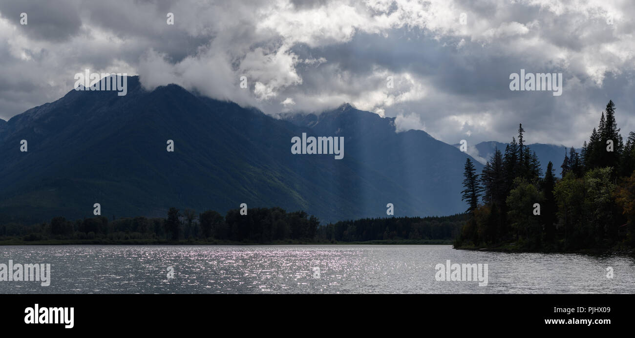 Panorama of Misty dramatic sky over mountains Stock Photo