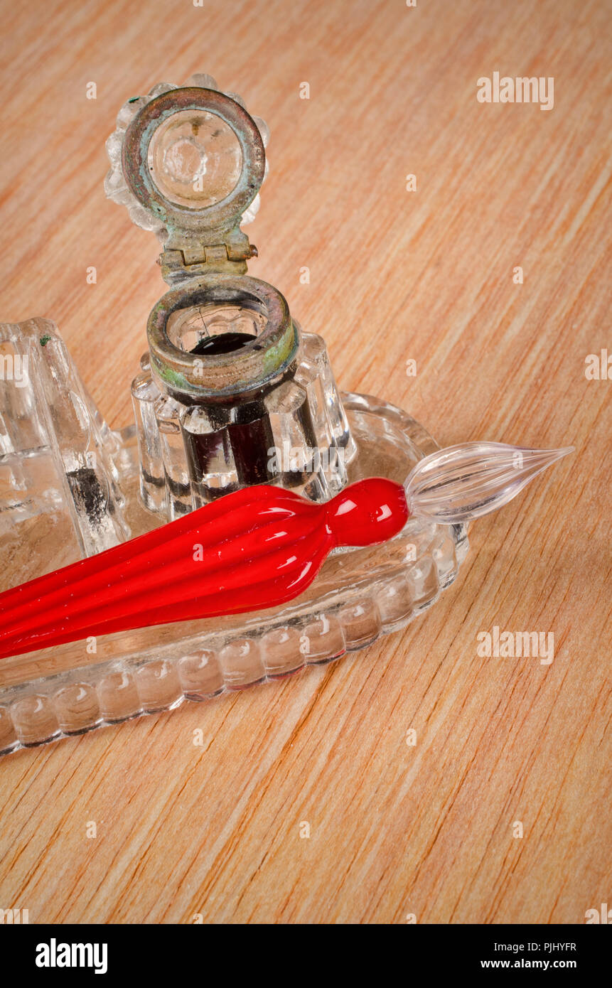 Vintage glass pen next to a classic inkwell Stock Photo Alamy