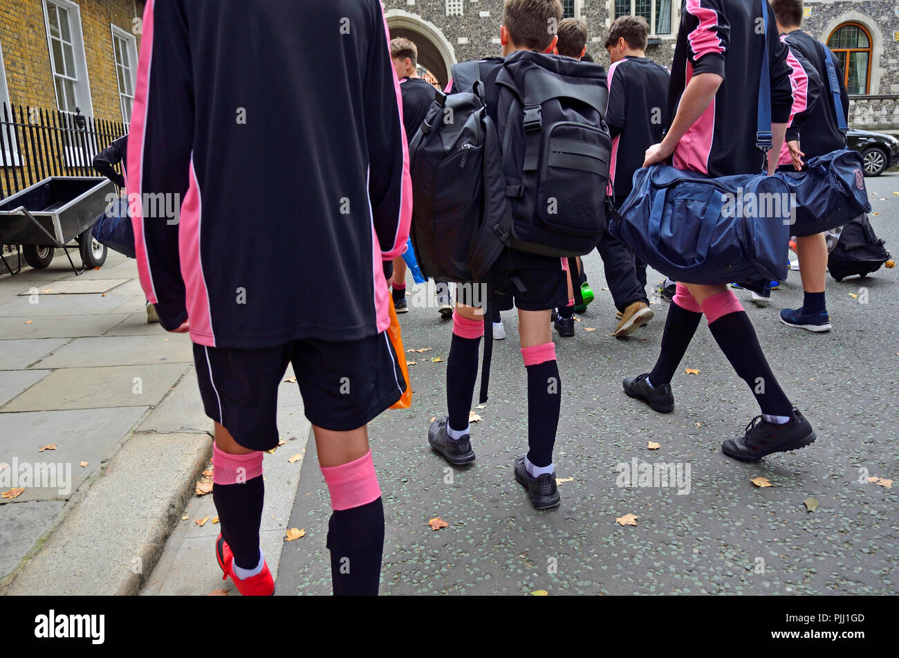 Schoolboys going to a sports lesson in uniform sports kit - London, England, UK. Stock Photo