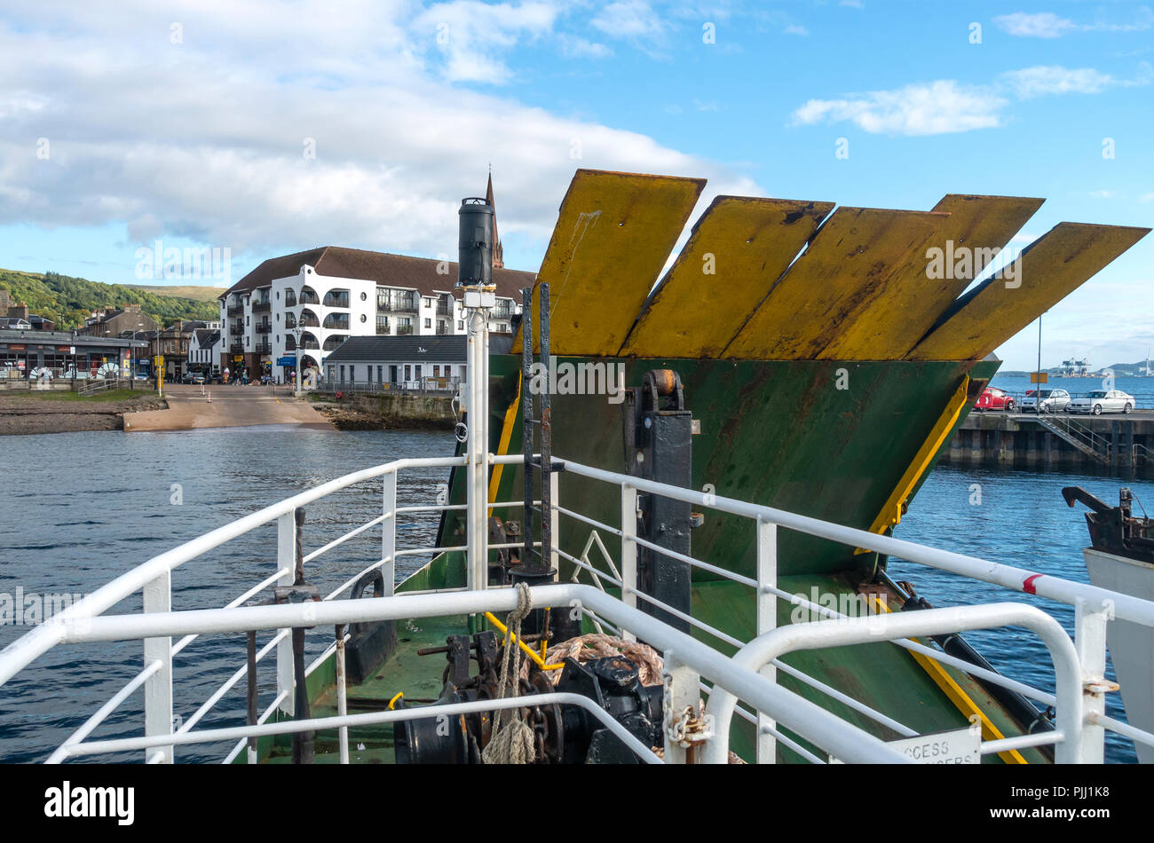 The CalMac drive-through ferry, MV Loch Riddon, lowering its ramp as it comes into Largs Pier from the Isle of Cumbrae (Millport) Stock Photo