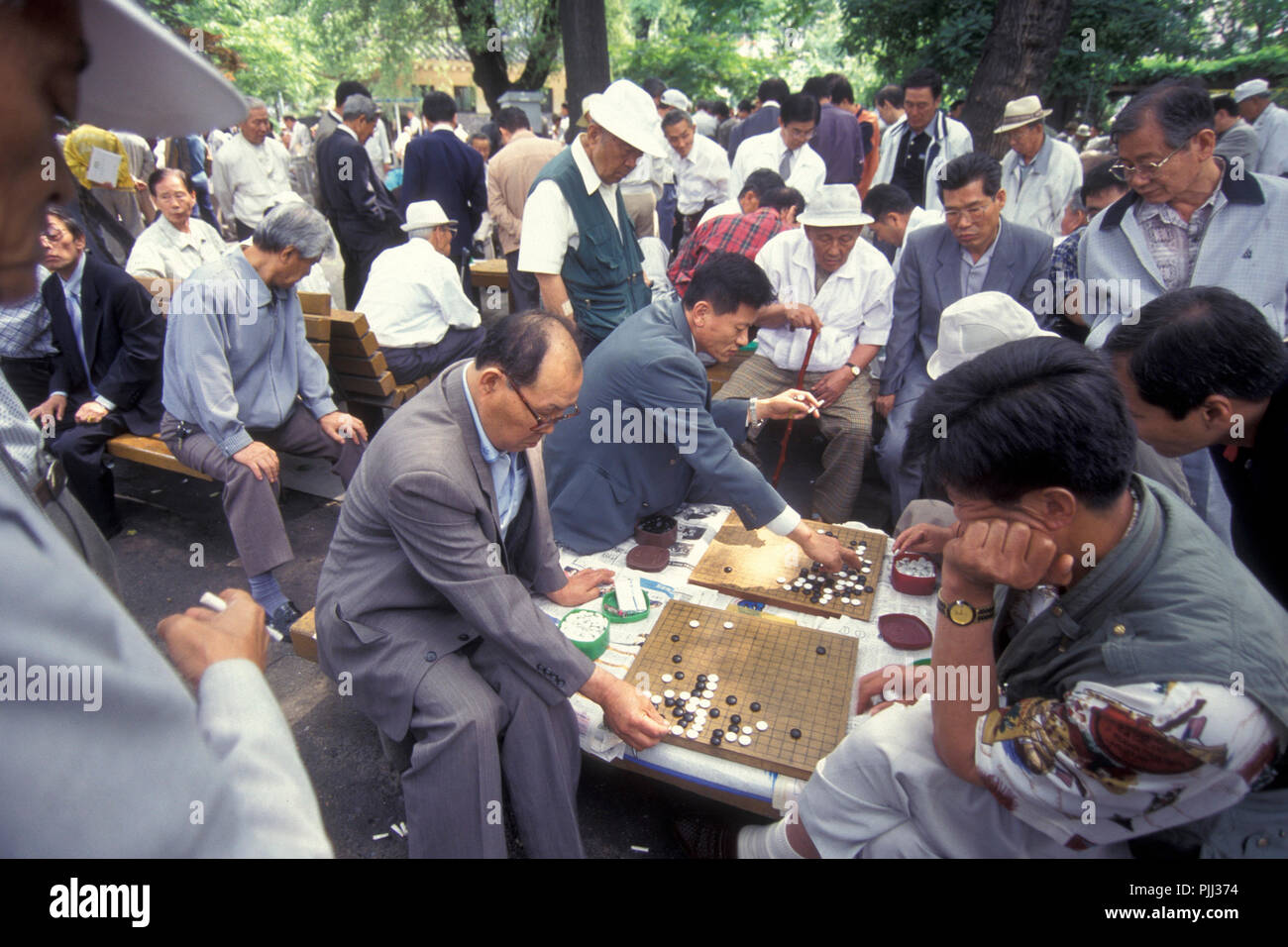 seniors play a board game at the Tapkol Prk in the city of Seoul in