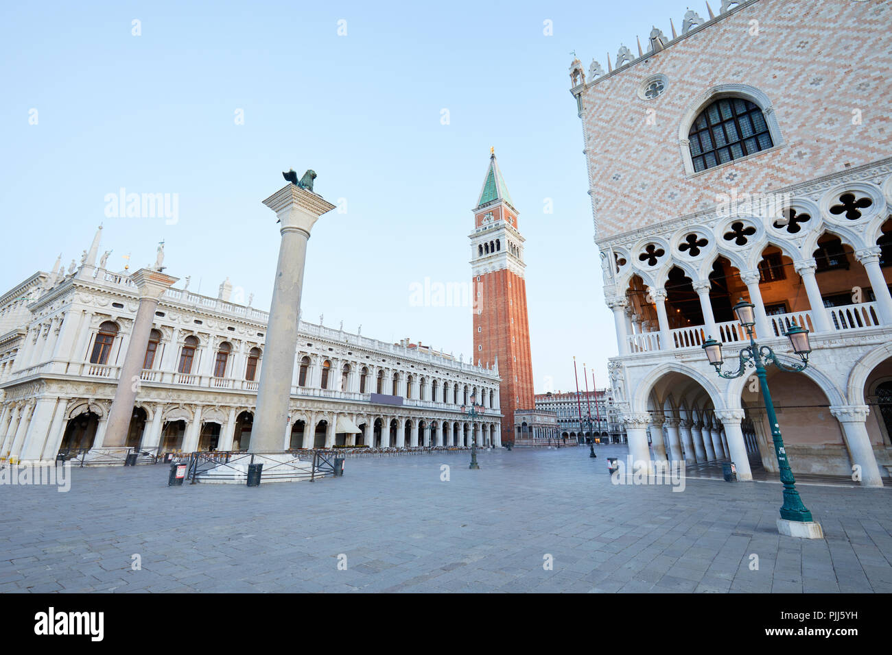 Saint Mark bell tower, National Marciana library and Doge palace view, nobody in the early morning in Venice, Italy Stock Photo