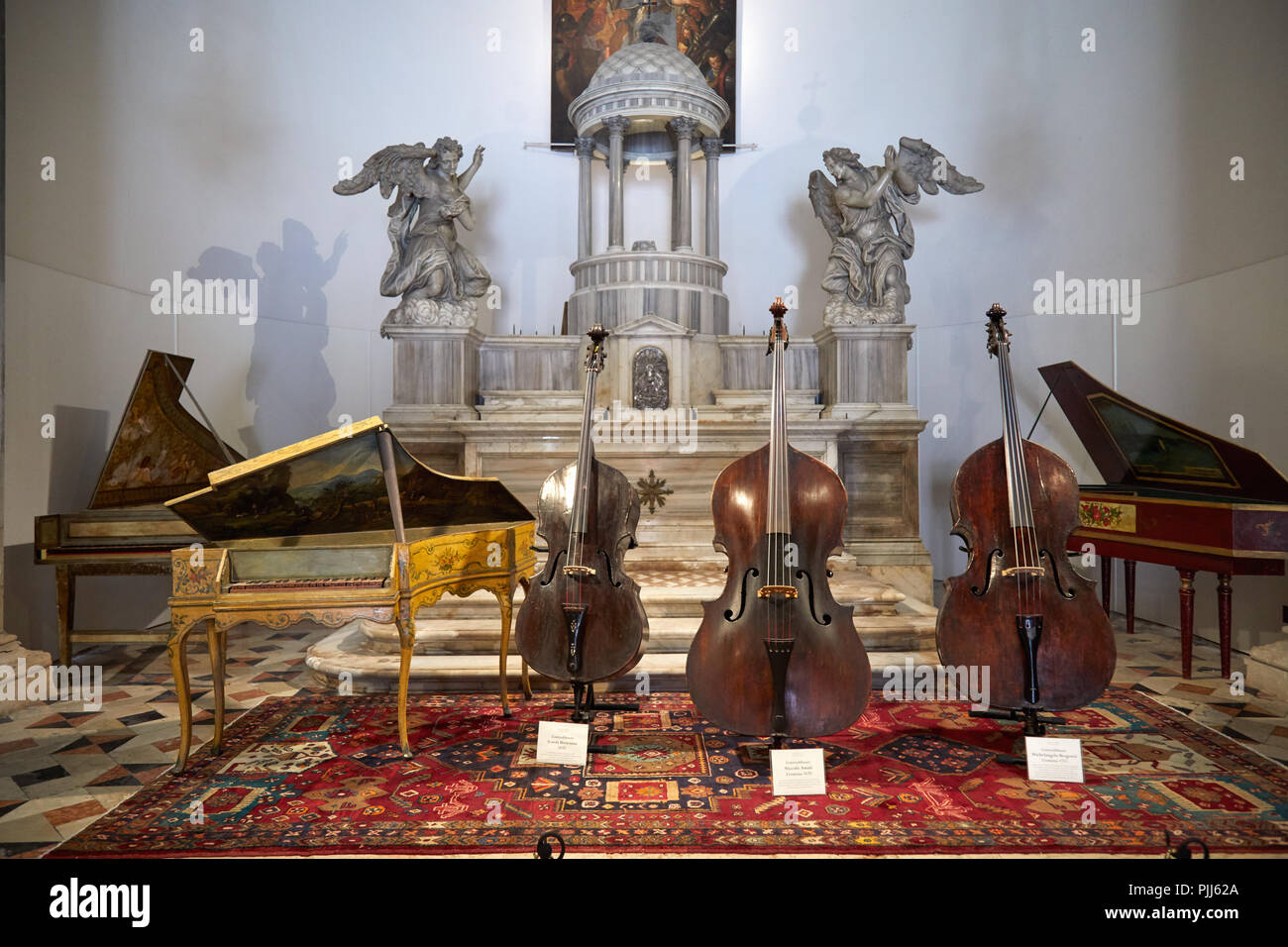 VENICE, ITALY - AUGUST 14, 2017: Ancient Italian string instruments exhibition in San Maurizio church in Venice, Italy Stock Photo