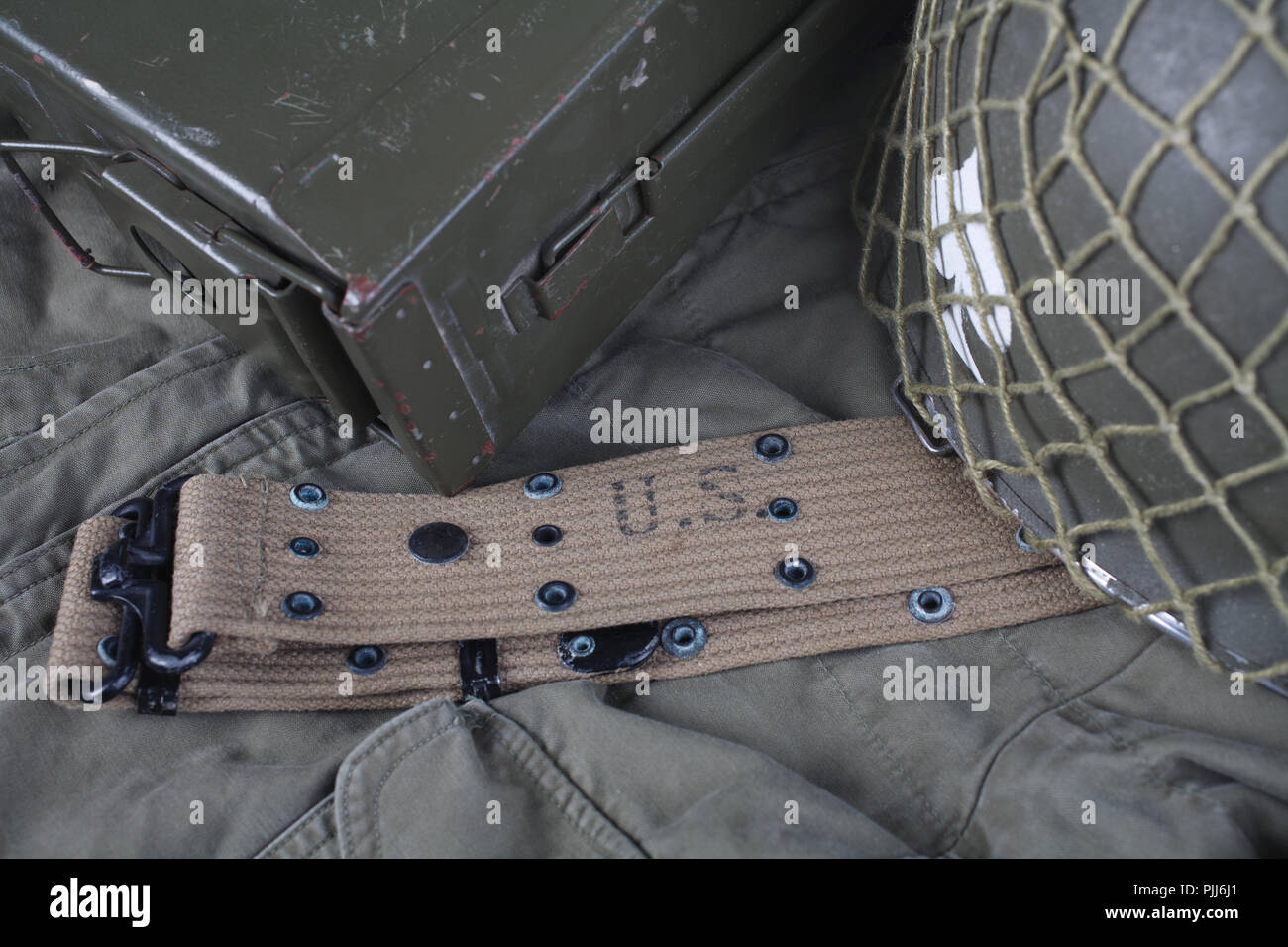 ww2 us army pistol belt and helmet with ace of spades emblem on green ...