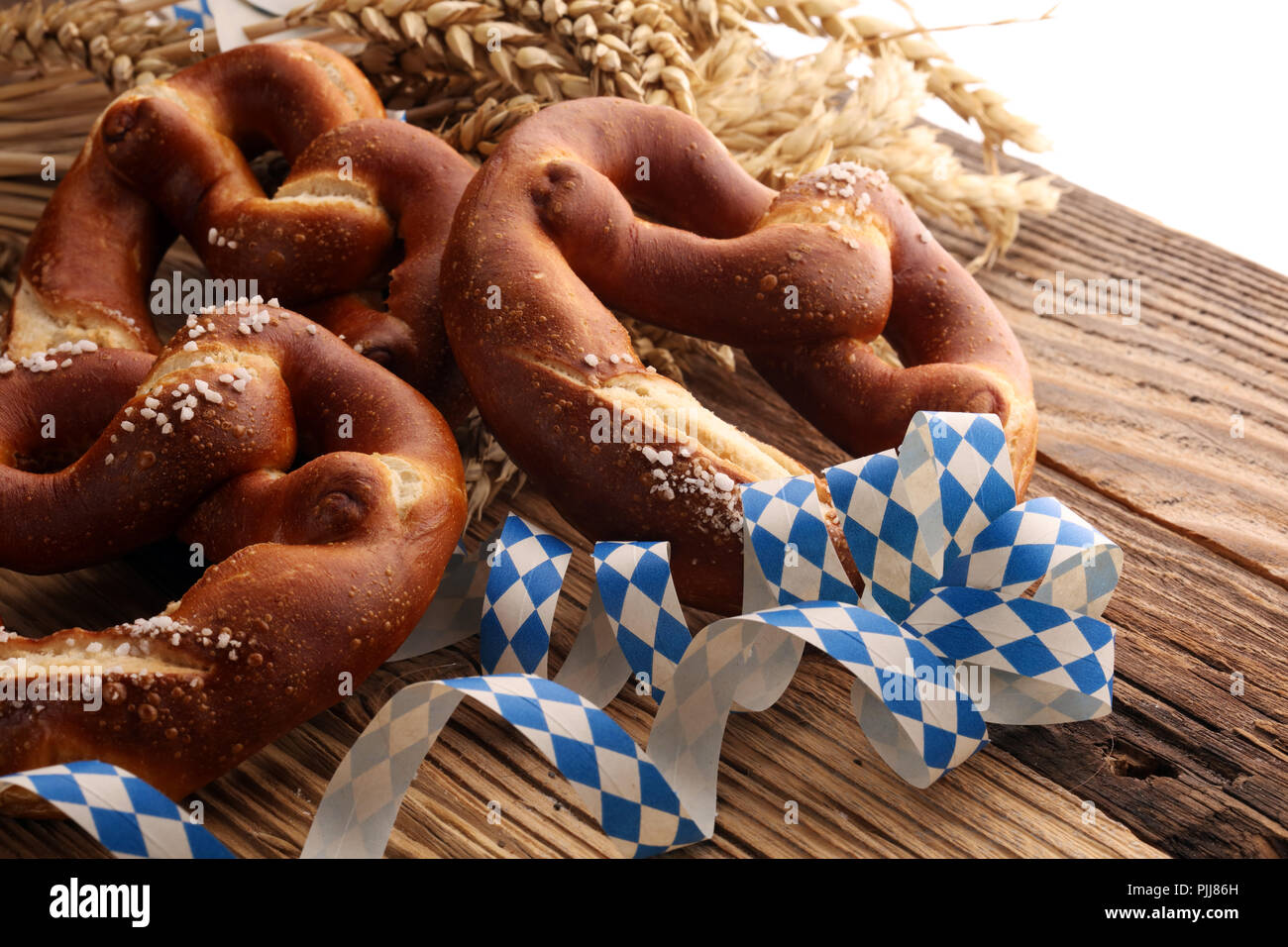German pretzels with salt close-up on the table Stock Photo - Alamy