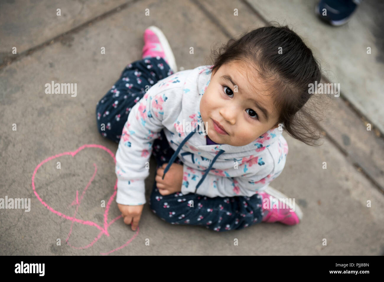 Kids Drawing with Chalk on Sidewalk Stock Photo - Alamy
