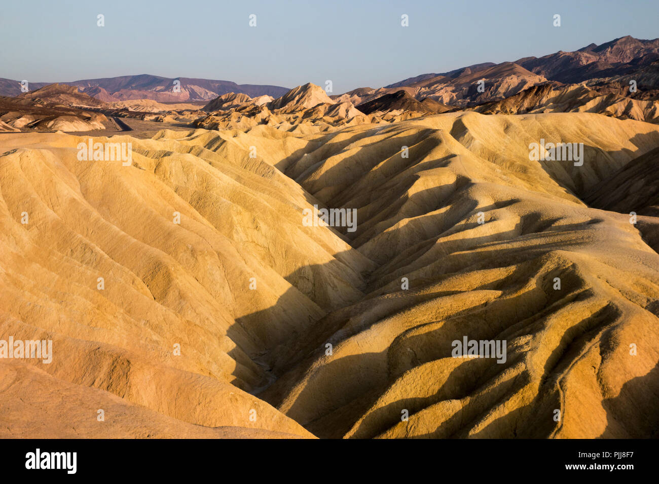 Badlands formations of Zabriskie Point, ancient desert colourful landscape, surreal landscape, world's lifeless hottest place, road trip Death Valley Stock Photo