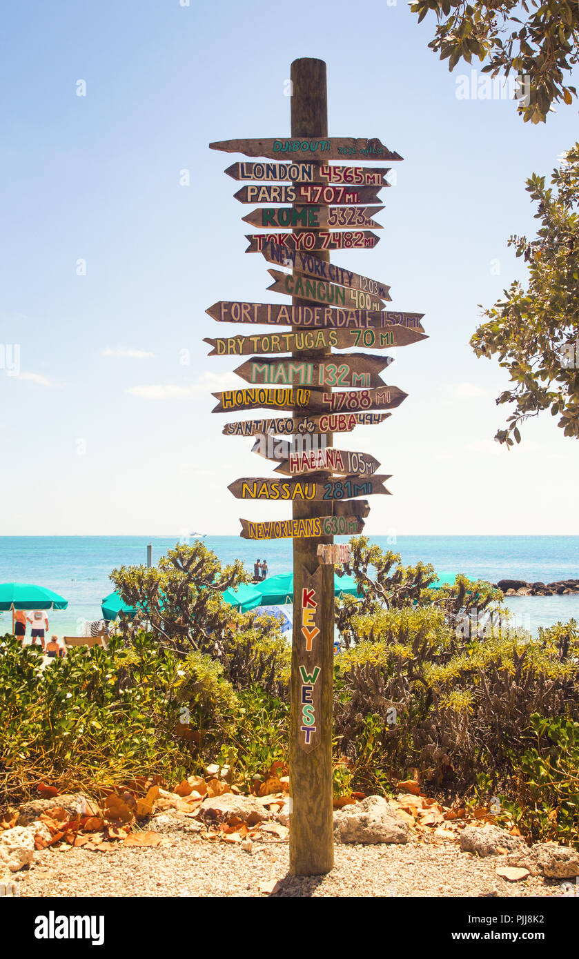 Directional signpost on the southernmost point of USA- Key West, Fort Zachary Taylor Historic State Park tropical sandy beach on daylight Stock Photo