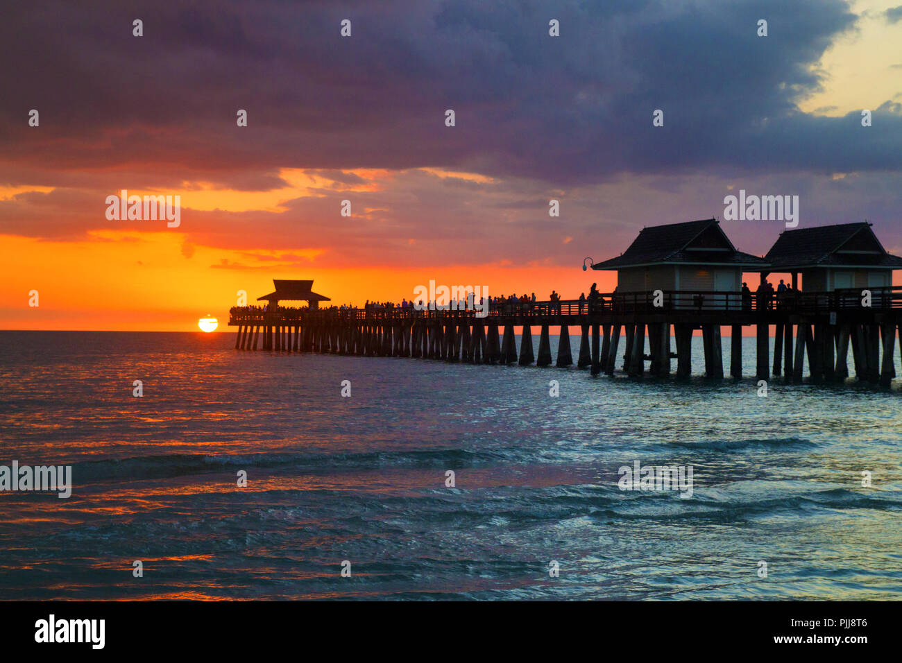 Florida city of Naples Pier during beautiful sunset after warm sunny