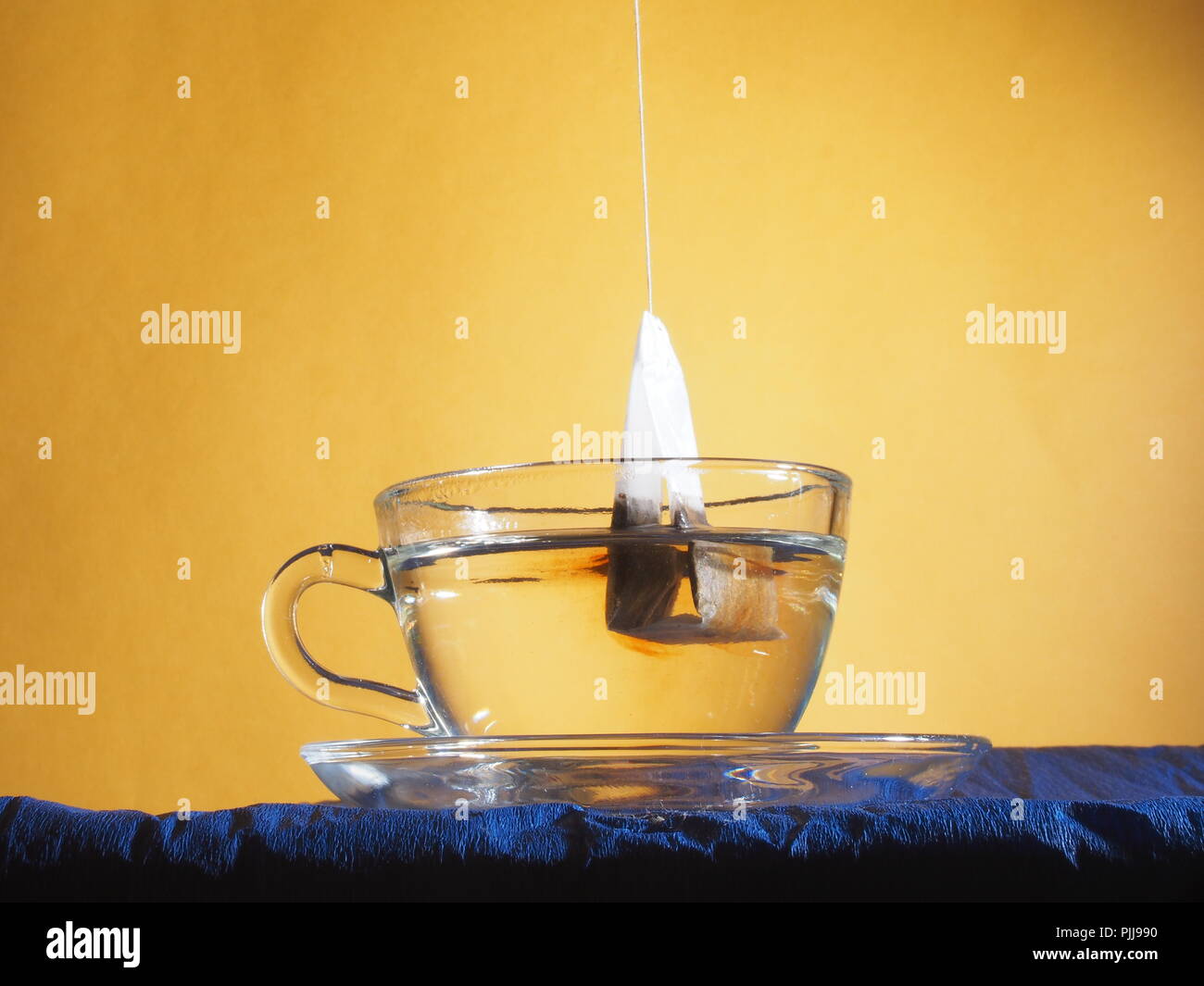 Brewing tea in a transparent glass Cup with a tea bag. Stilllife Stock