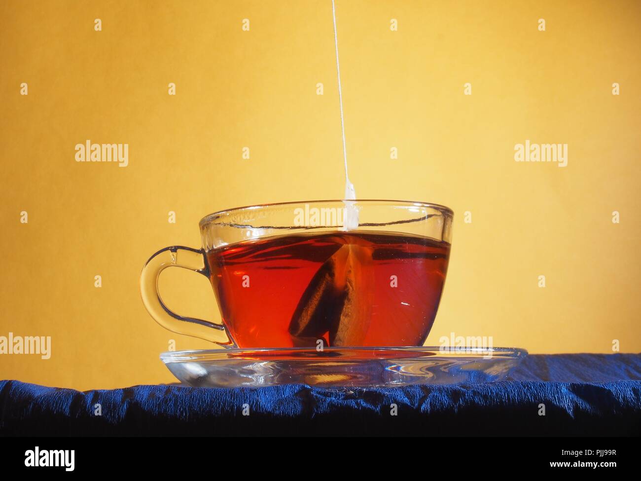 Brewing tea in a transparent glass Cup with a tea bag. Stilllife Stock