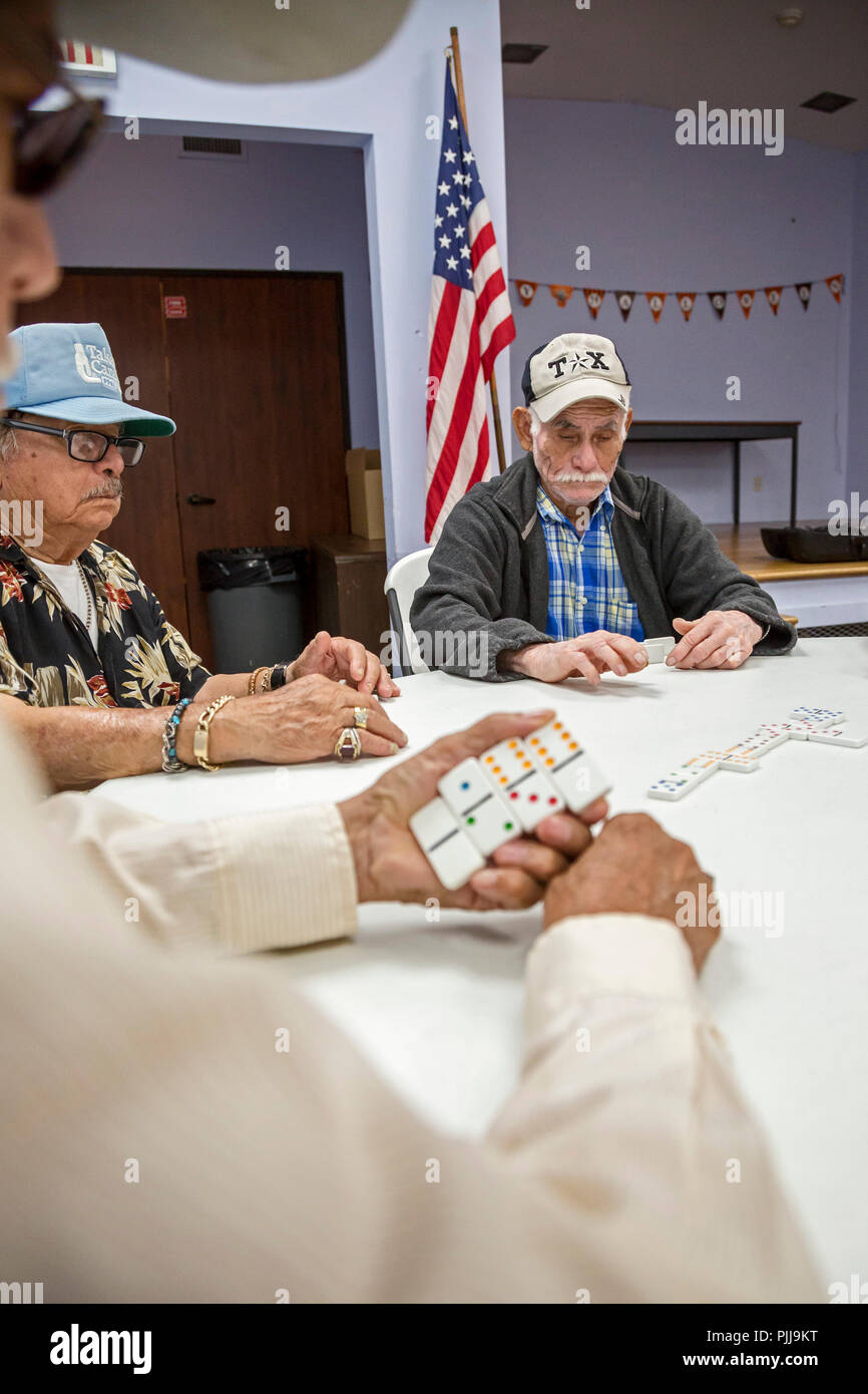 Houston, Texas - Senior citizens play dominoes at Wesley Community Center. Stock Photo
