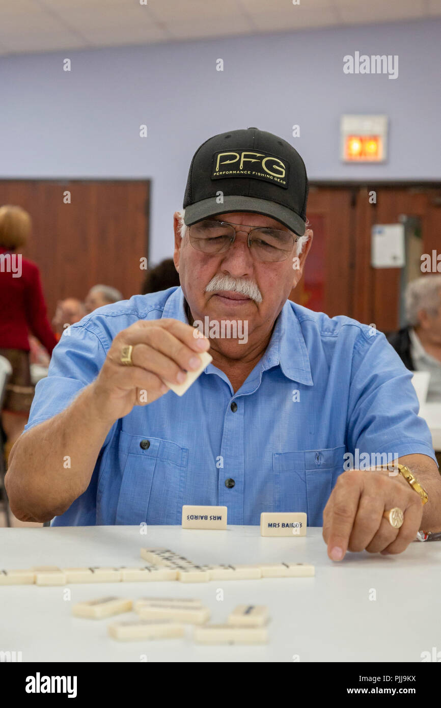 Houston, Texas - Senior citizens play dominoes at Wesley Community Center. Stock Photo